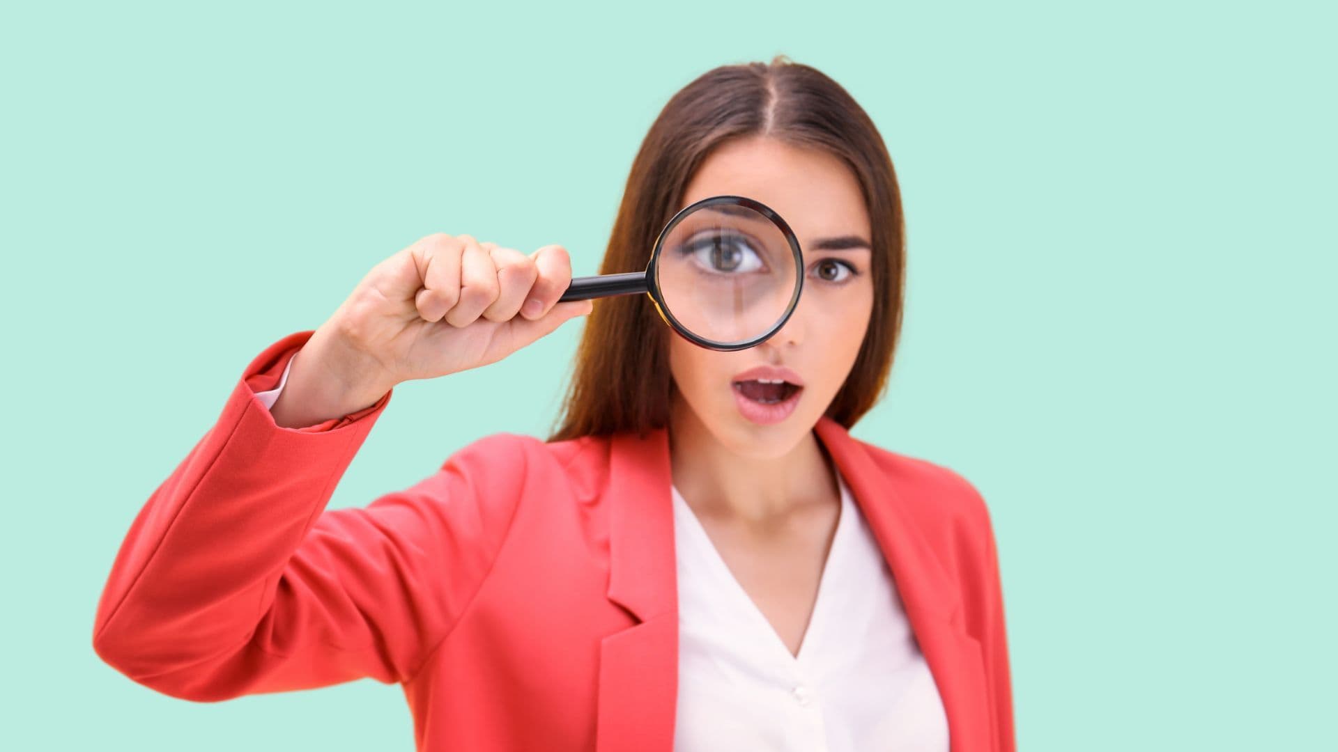 a woman looking closely through a magnifying glass